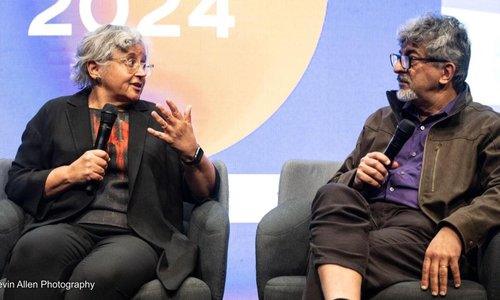 Photo of Cecilia Conrad and Rakesh Rajani speaking at Devex World conference