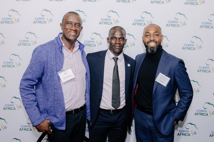 Photo of Muhsin Hassan and two attendees posing for a photo at CorpsAfrica's 2024 UNGA Reception