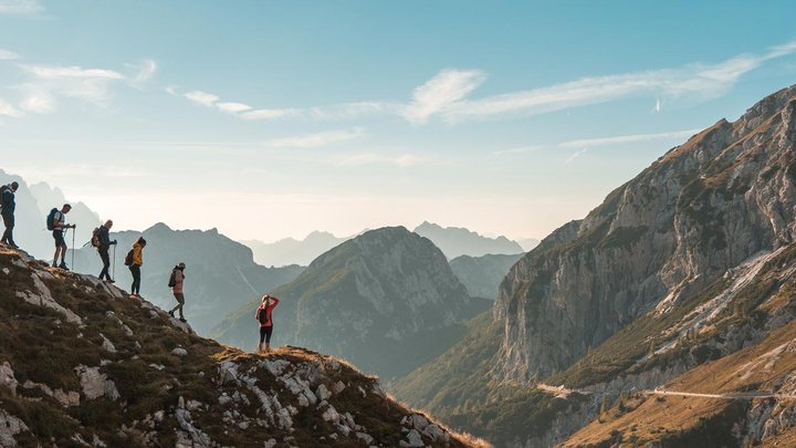 Image of hikers walking along a mountain range